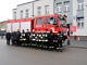 Nowy samochód ratowniczo-gaśniczy a przed nim grupa strażaków i przedstawicieli Urzędu Gminy Wola Krzysztoporska
